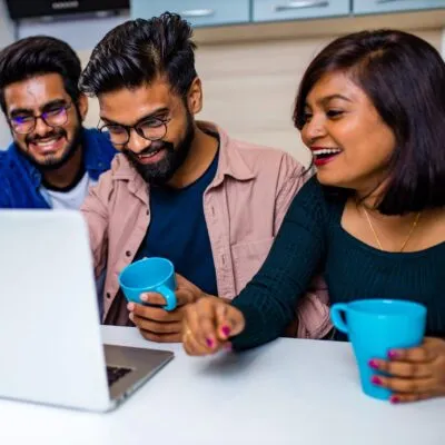indian-four-people-in-kitchen-looking-at-laptop-an-2024-10-30-21-40-51-utc-min